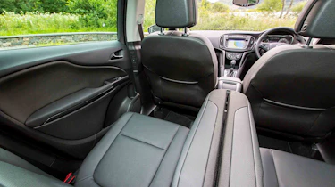 The second row is very comfortable with adults and can be adjusted to give more legroom