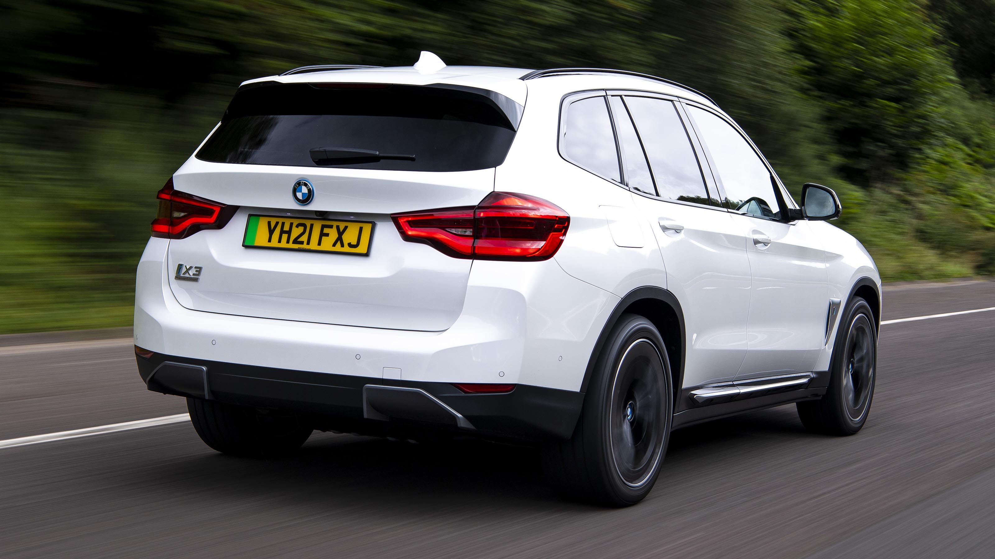 BMW iX3 SUV rear 3/4 tracking