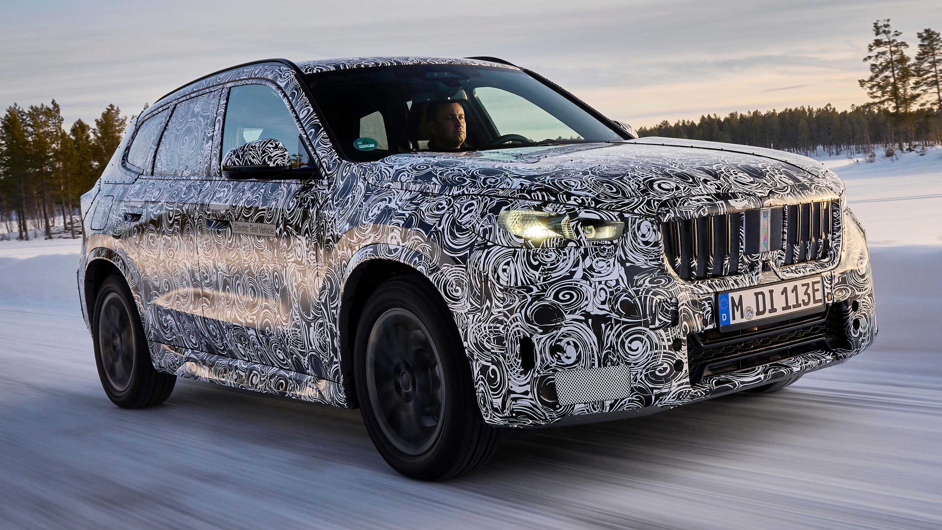 BMW iX1 winter testing front corner driving